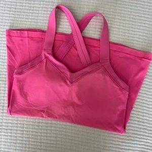 Lululemon hot pink criss cross tank. Size 4. Built in bra.